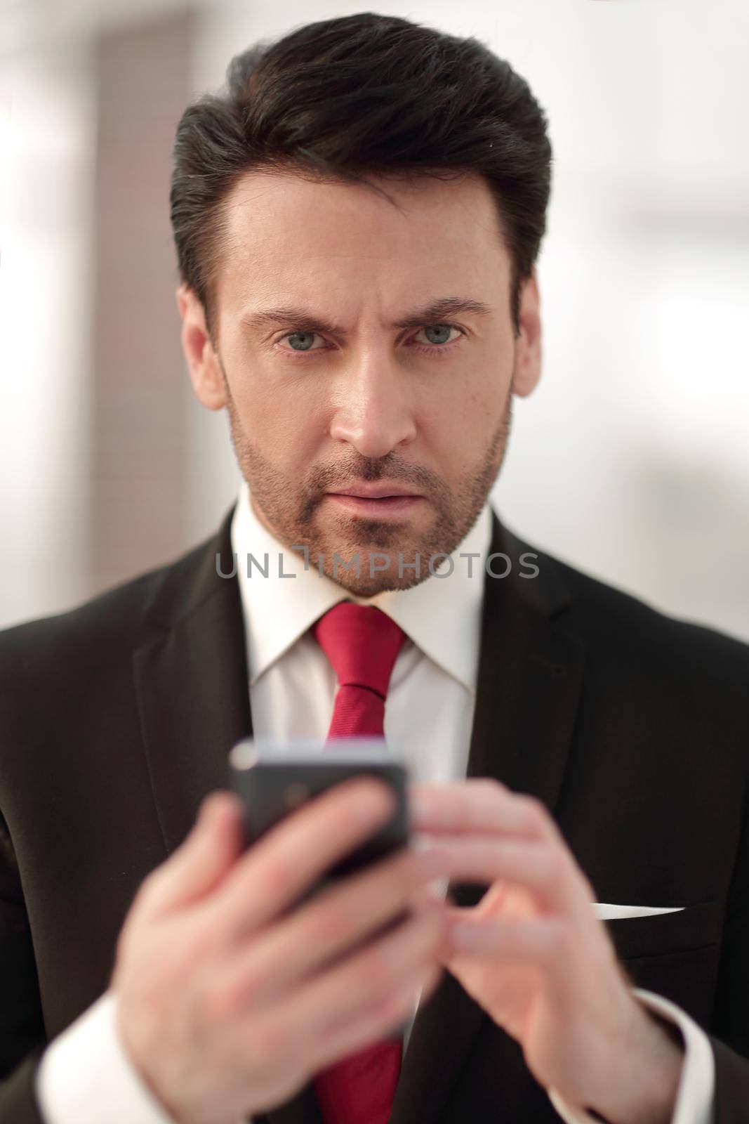 close up.businessman is typing SMS by asdf