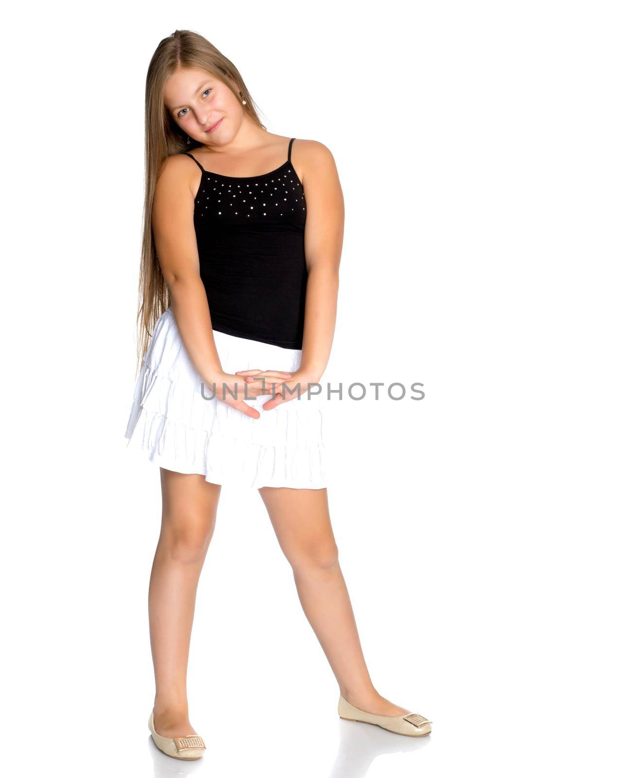 Beautiful teenage girl in full growth on a white background. The concept of youth culture, education and school. Isolated.
