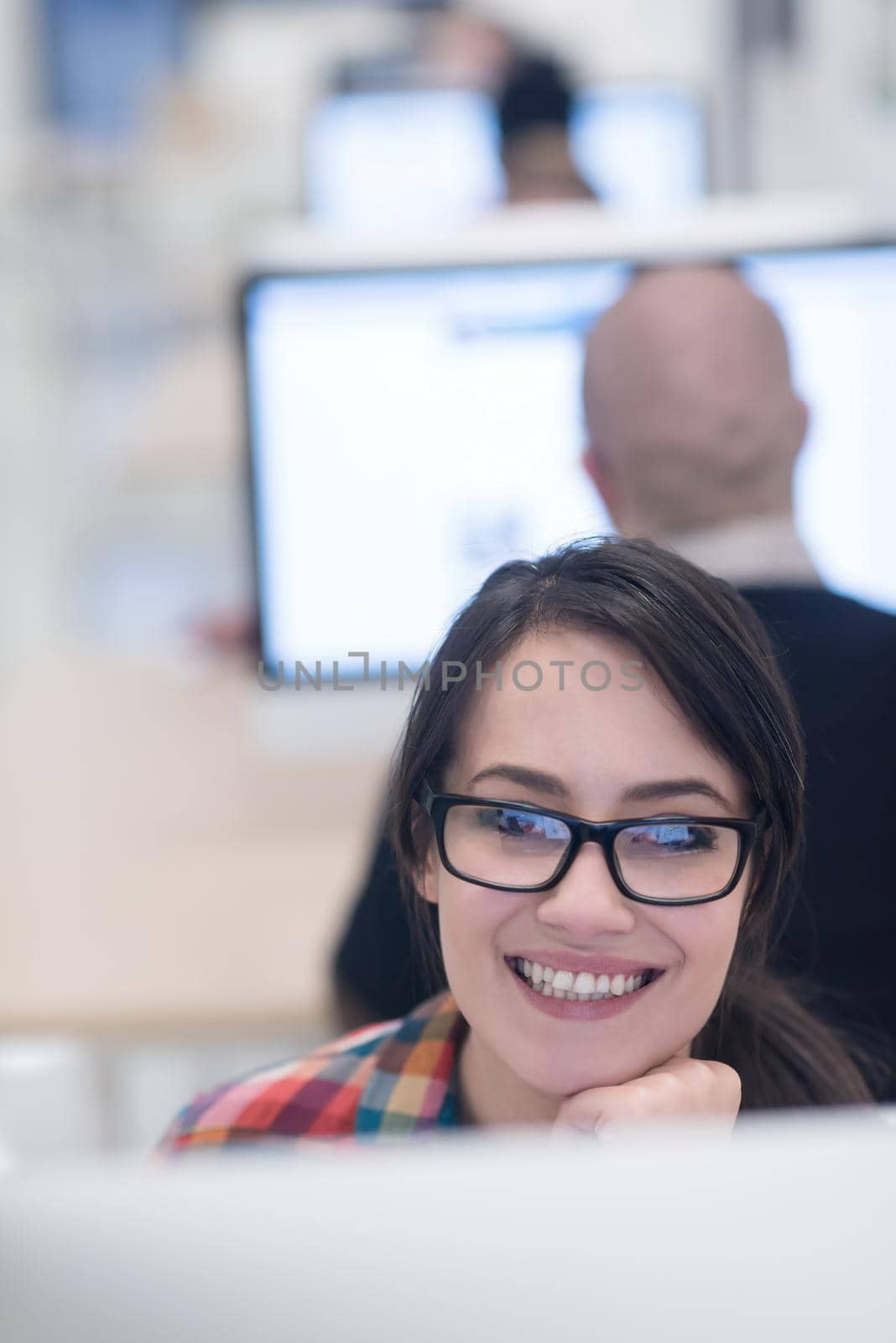 startup business, woman  working on dektop  computer at creative modern office relaxing and have fun