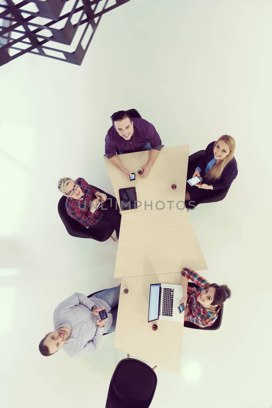 top view of multi ethnic startup business people group on brainstorming meeting in modern bright office interior