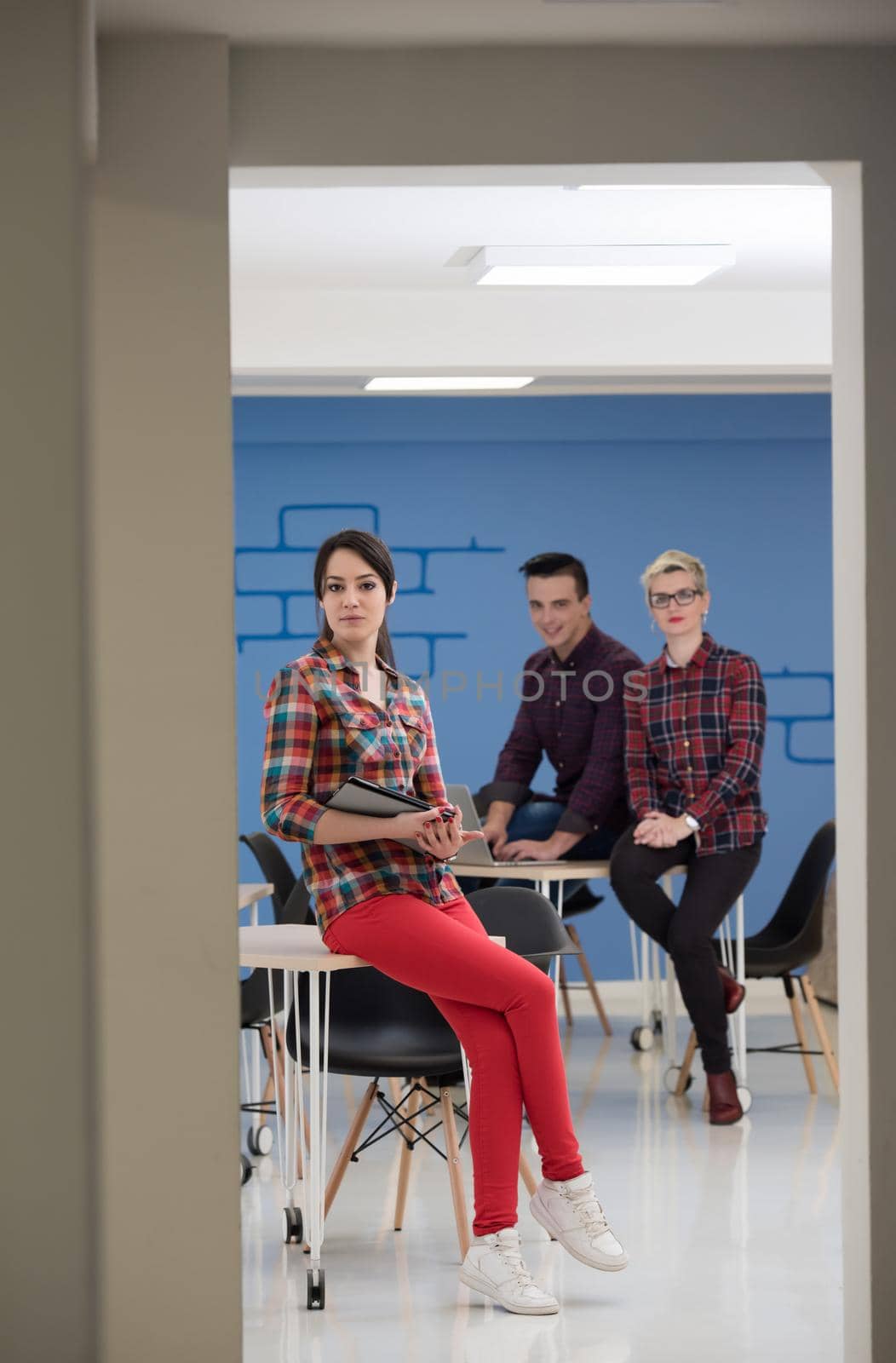 startup business team on meeting in modern bright office interior brainstorming, working on laptop and tablet computer