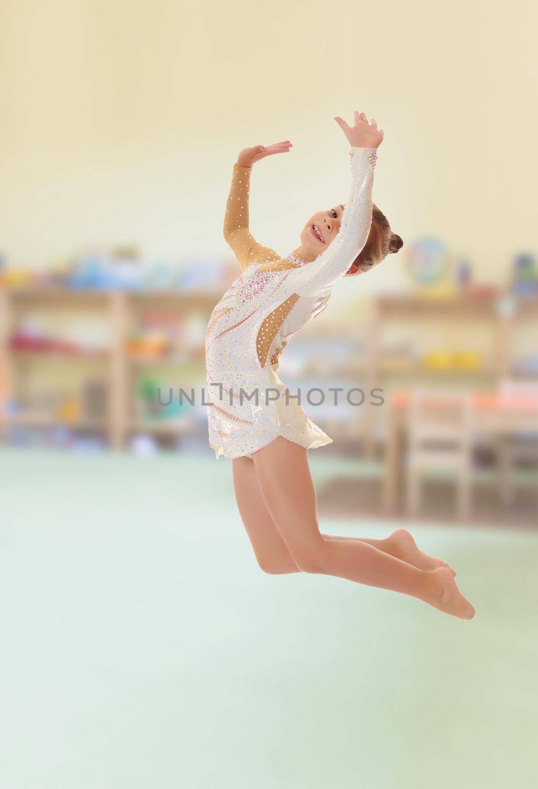Little gymnast jumping by kolesnikov_studio