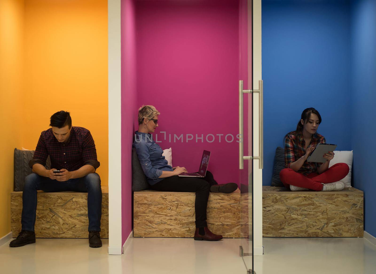 group of young business people having fun, relaxing and working in creative room space at modern startup office