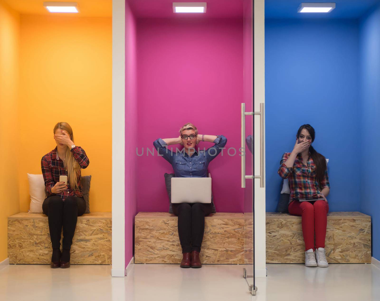 group of young business people having fun, relaxing and working in creative room space at modern startup office