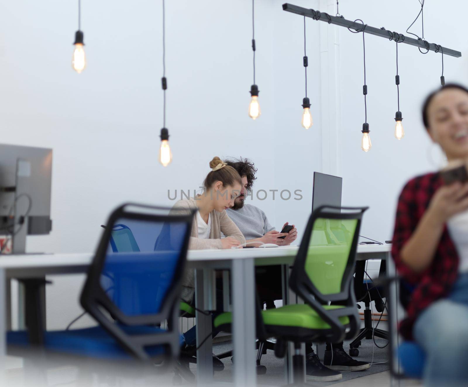 creative business people group as freelancers  in modern coworking open space office by dotshock