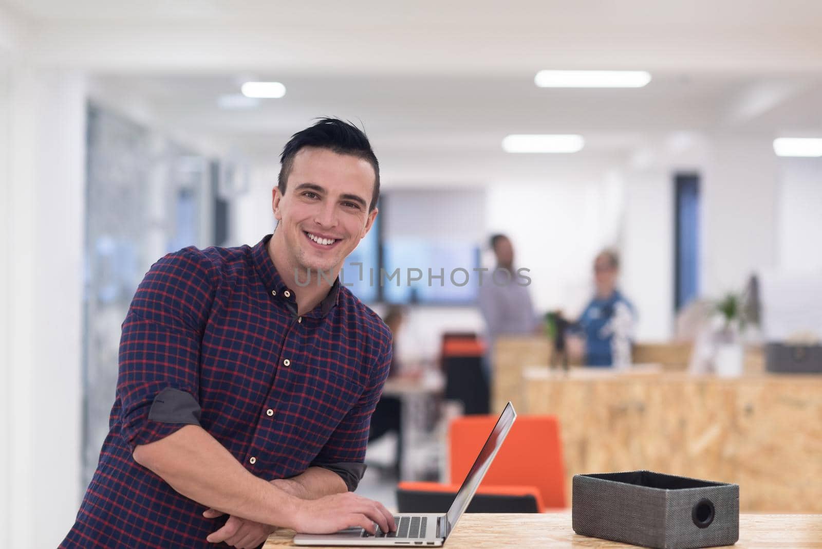 startup business, young  man portrait at modern office by dotshock