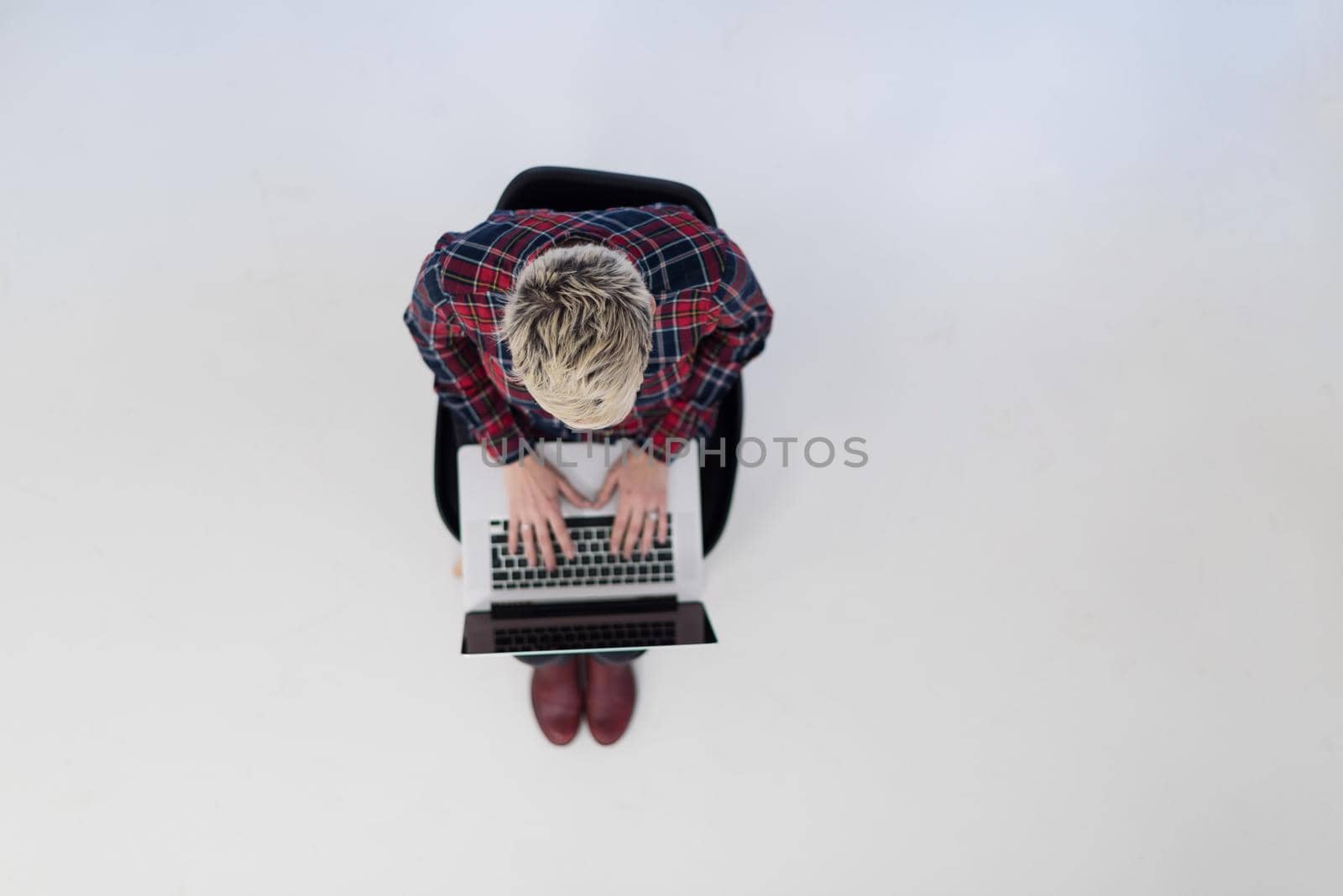top view of young business woman working on laptop computer by dotshock