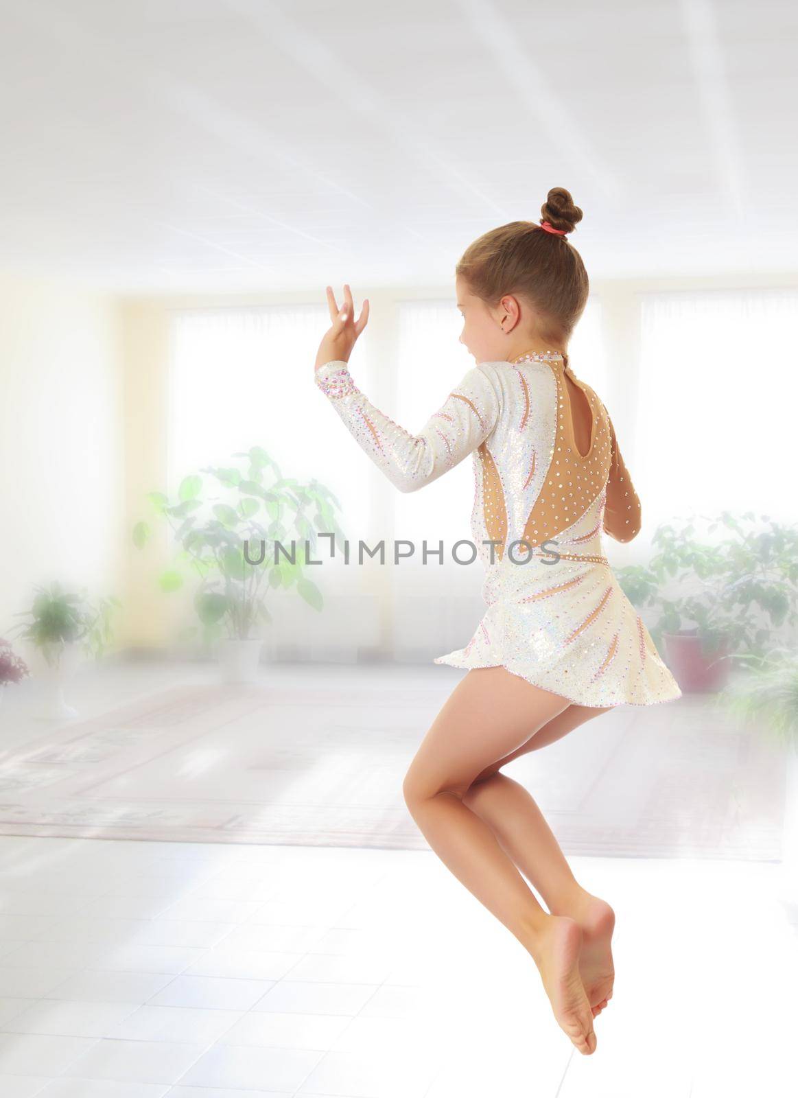 Little gymnast jumping by kolesnikov_studio