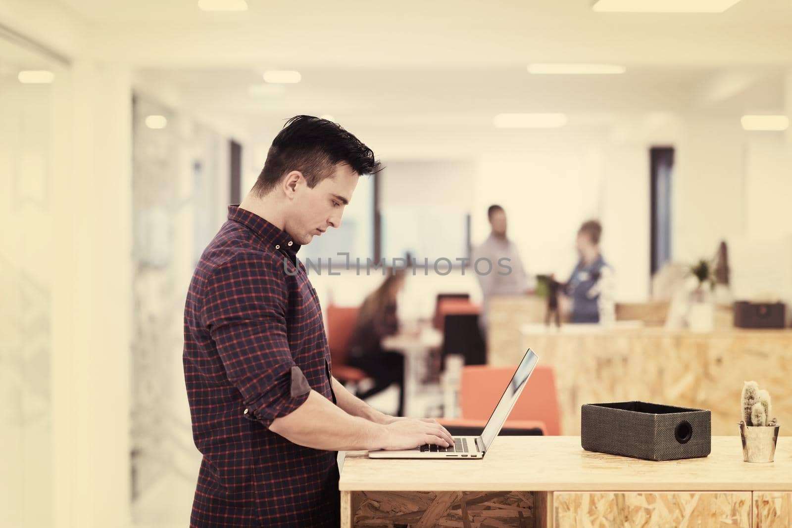 startup business, young  man portrait at modern office by dotshock