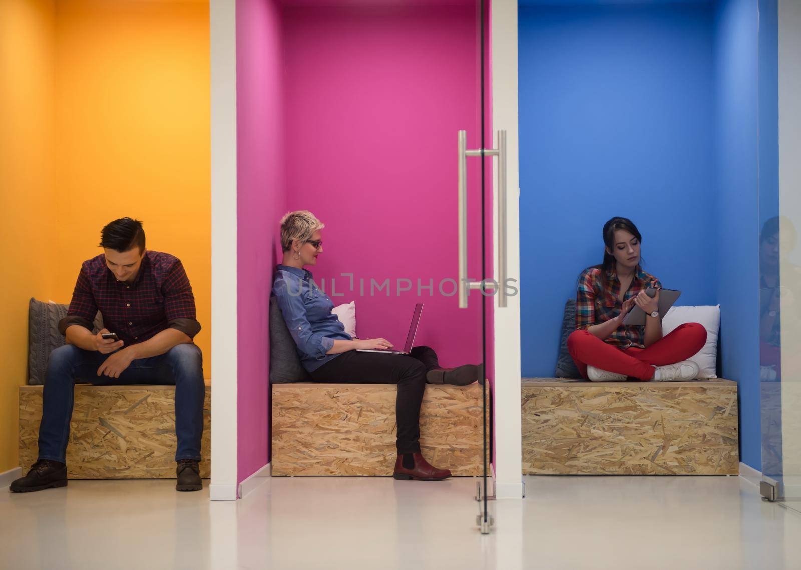 group of business people in creative working  space by dotshock