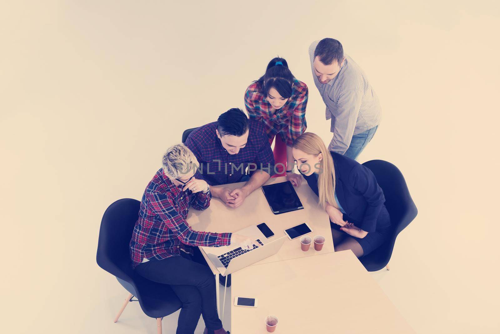 top view of multi ethnic startup business people group on brainstorming meeting in modern bright office interior