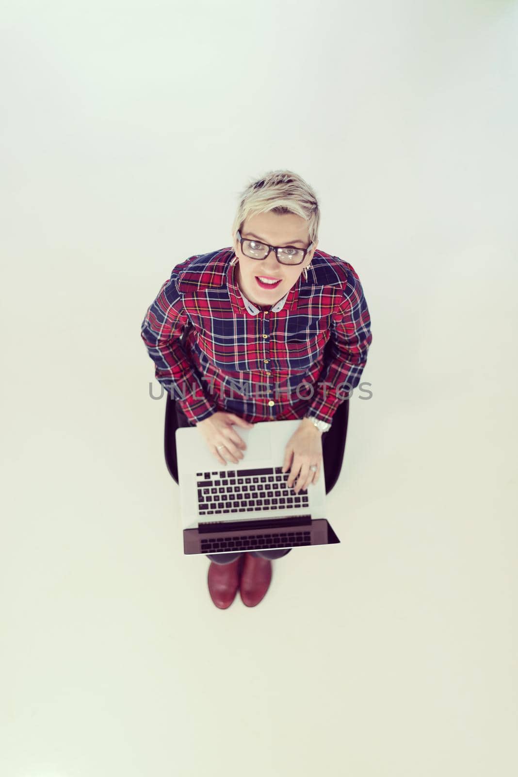 top view of young business woman working on laptop computer by dotshock