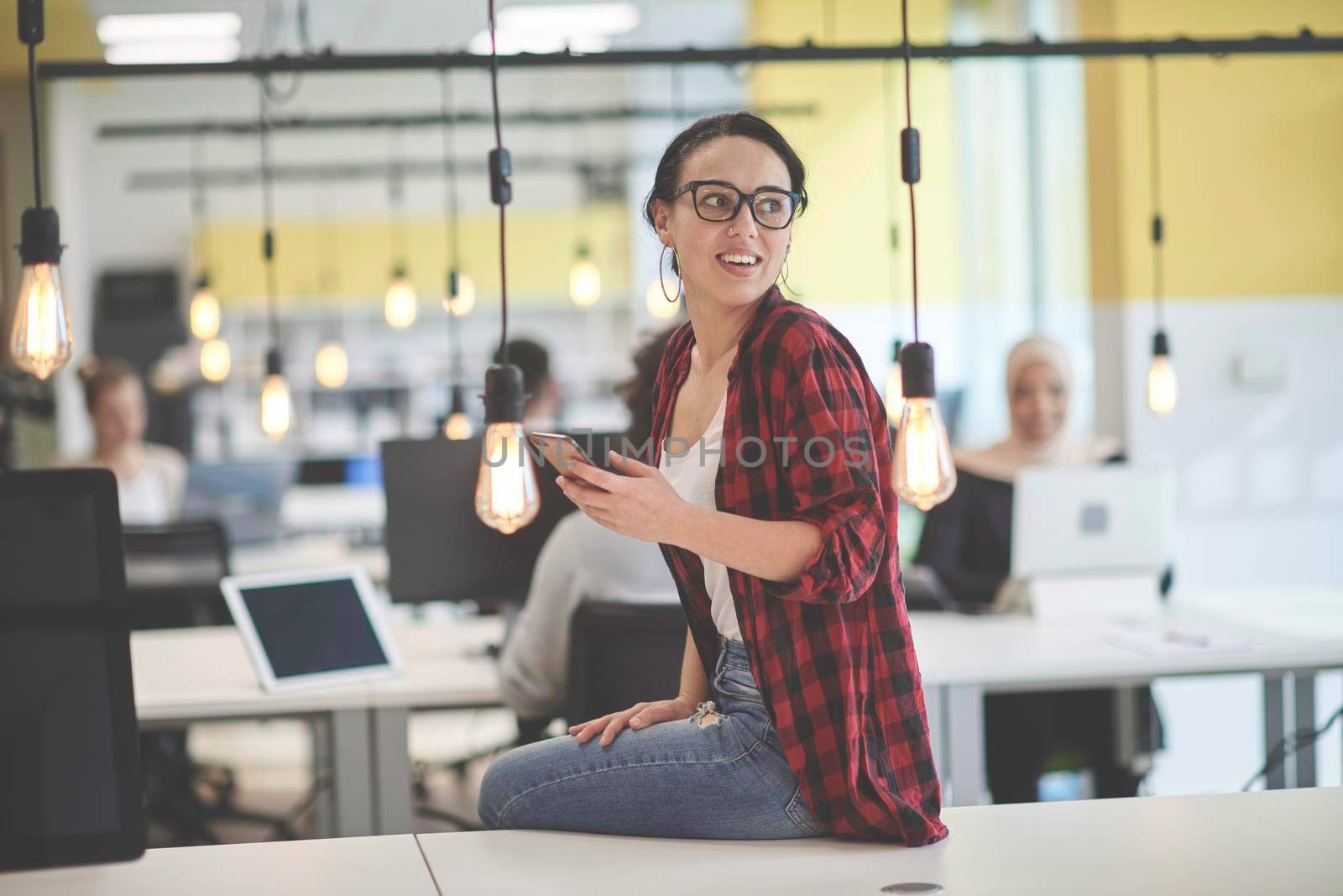 casual business woman at work  in creative modern coworking startup open space office