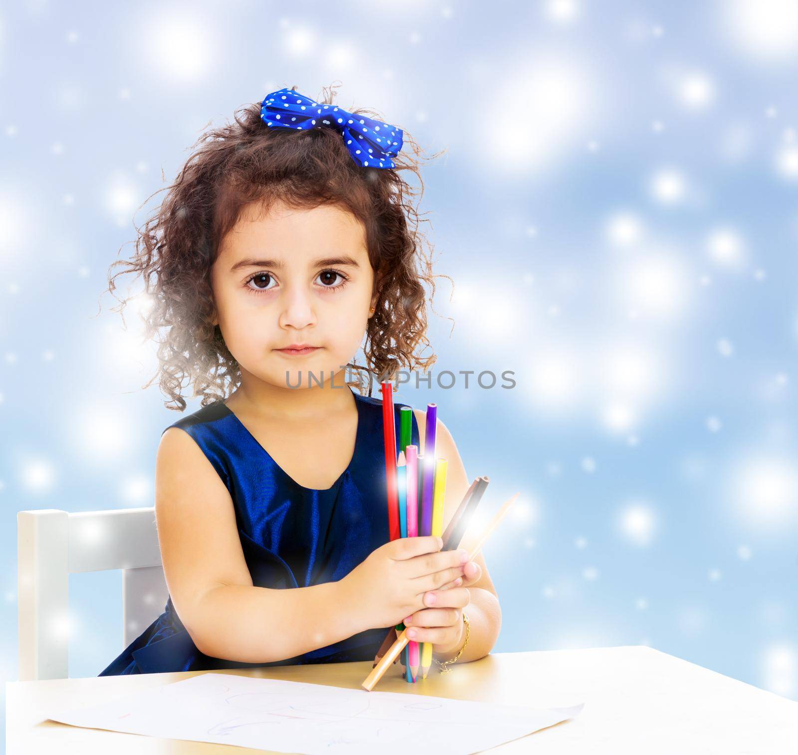 Little girl draws at the table with pencils by kolesnikov_studio