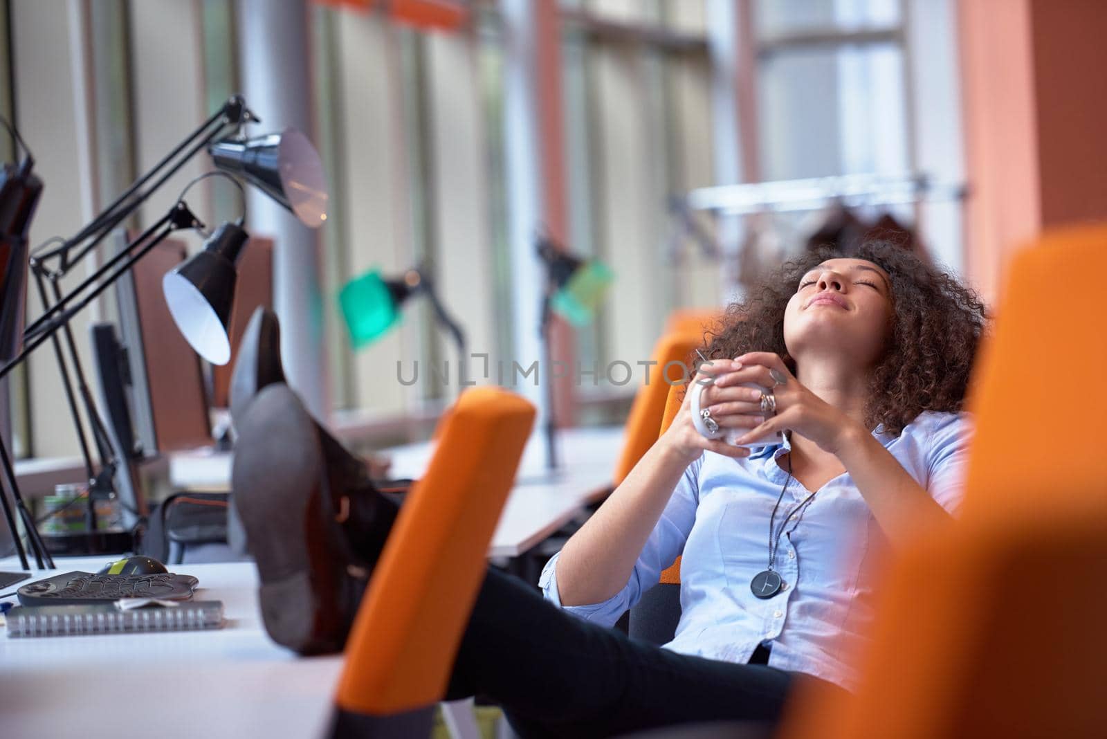 young  business woman at office by dotshock