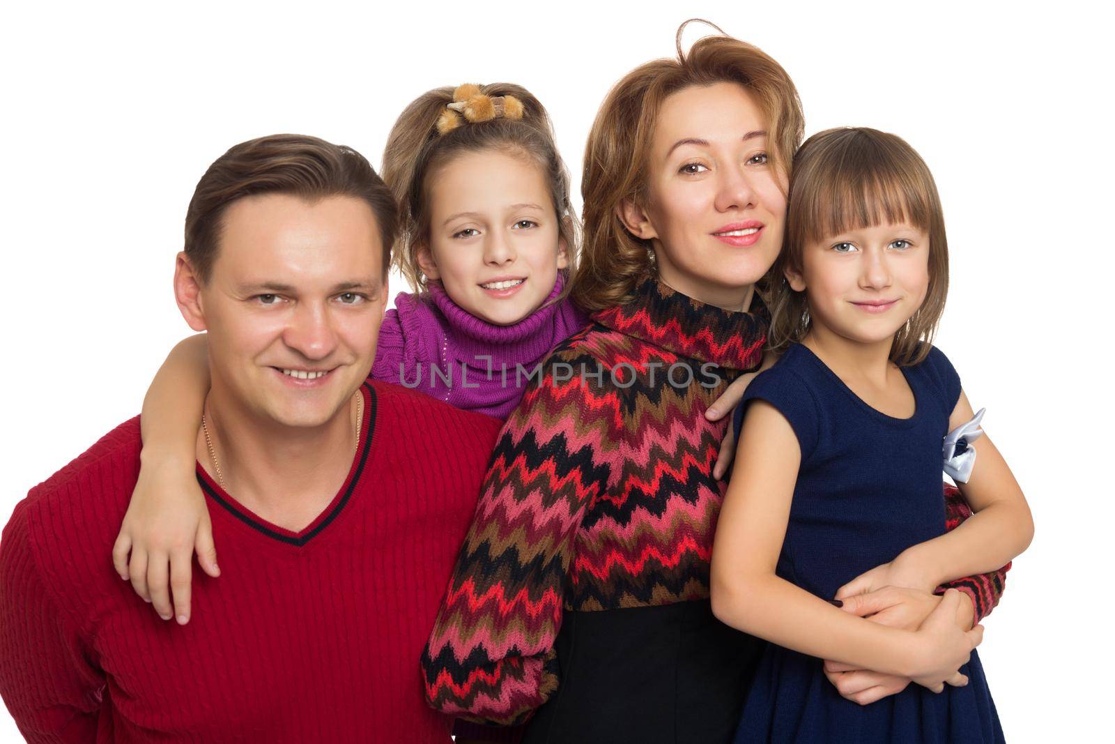 Happy family of four. Parents with their wonderful girls - Isolated on white background