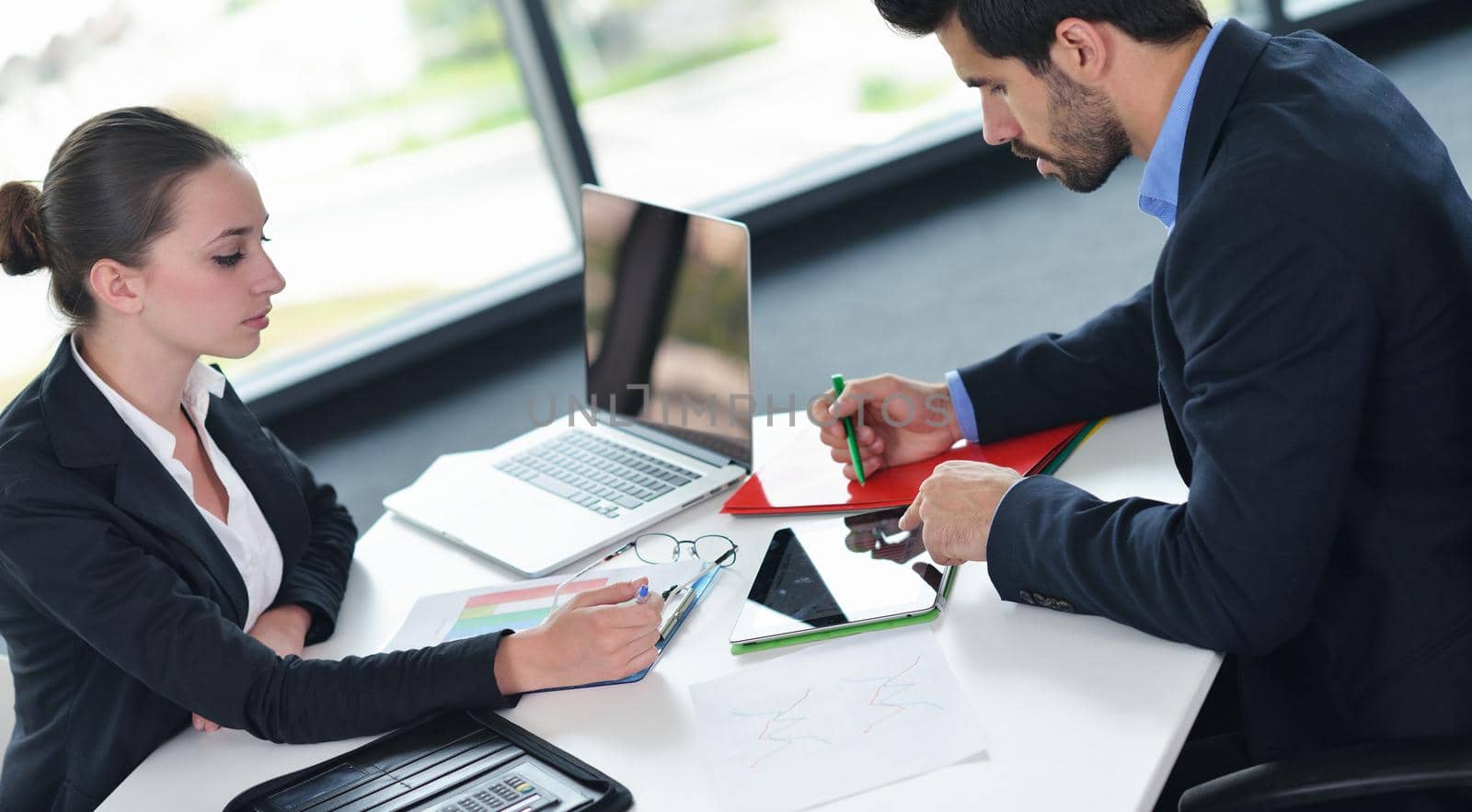 business people in a meeting at office by dotshock