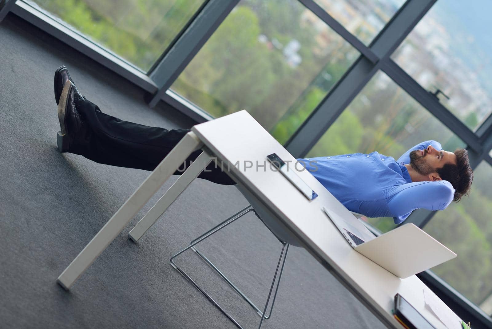 happy young business  man work in modern office on computer