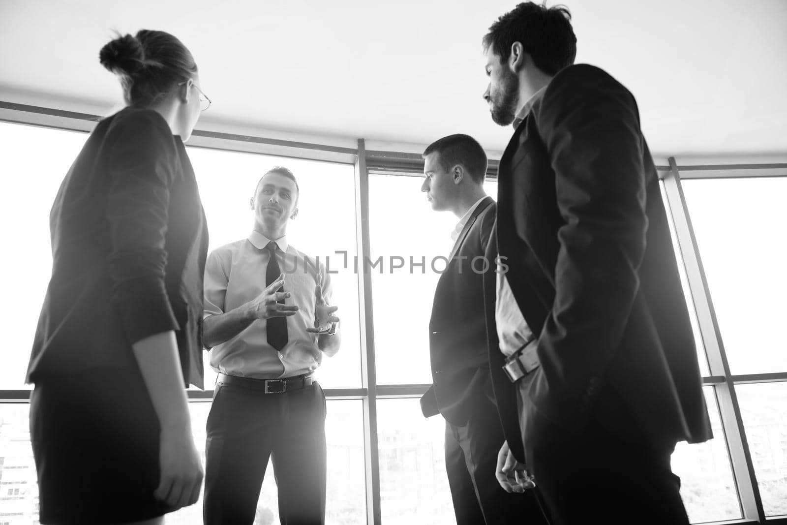 Group of happy young  business people in a meeting at office