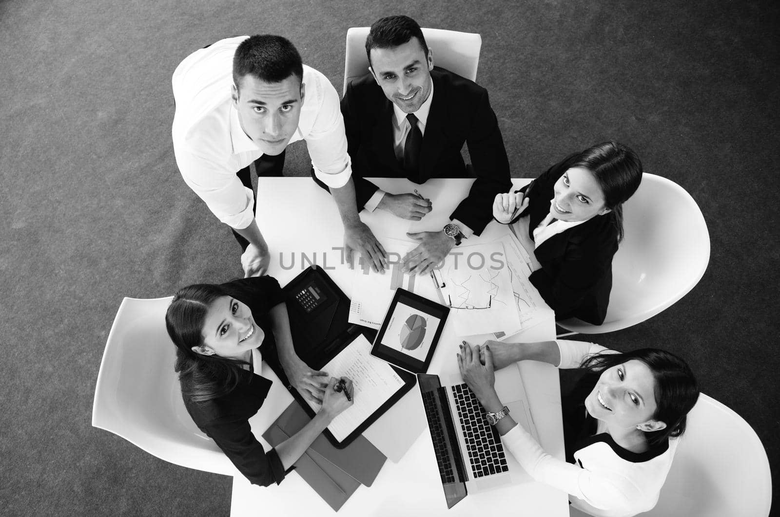 Group of happy young  business people in a meeting at office