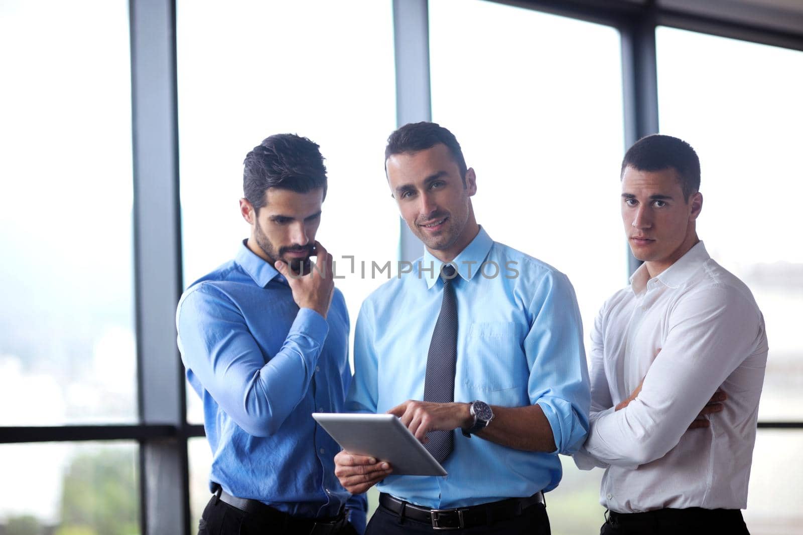 Group of happy young  business people in a meeting at office