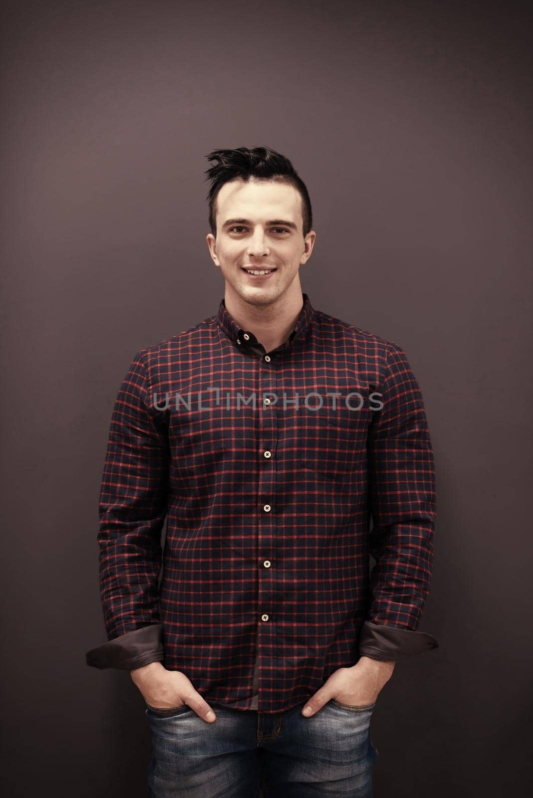portrait of young startup business man in plaid shirt by dotshock