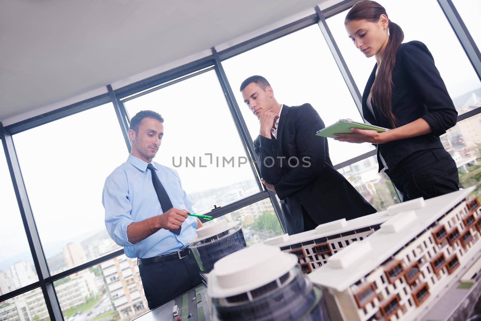 Group of happy young  business people in a meeting at office