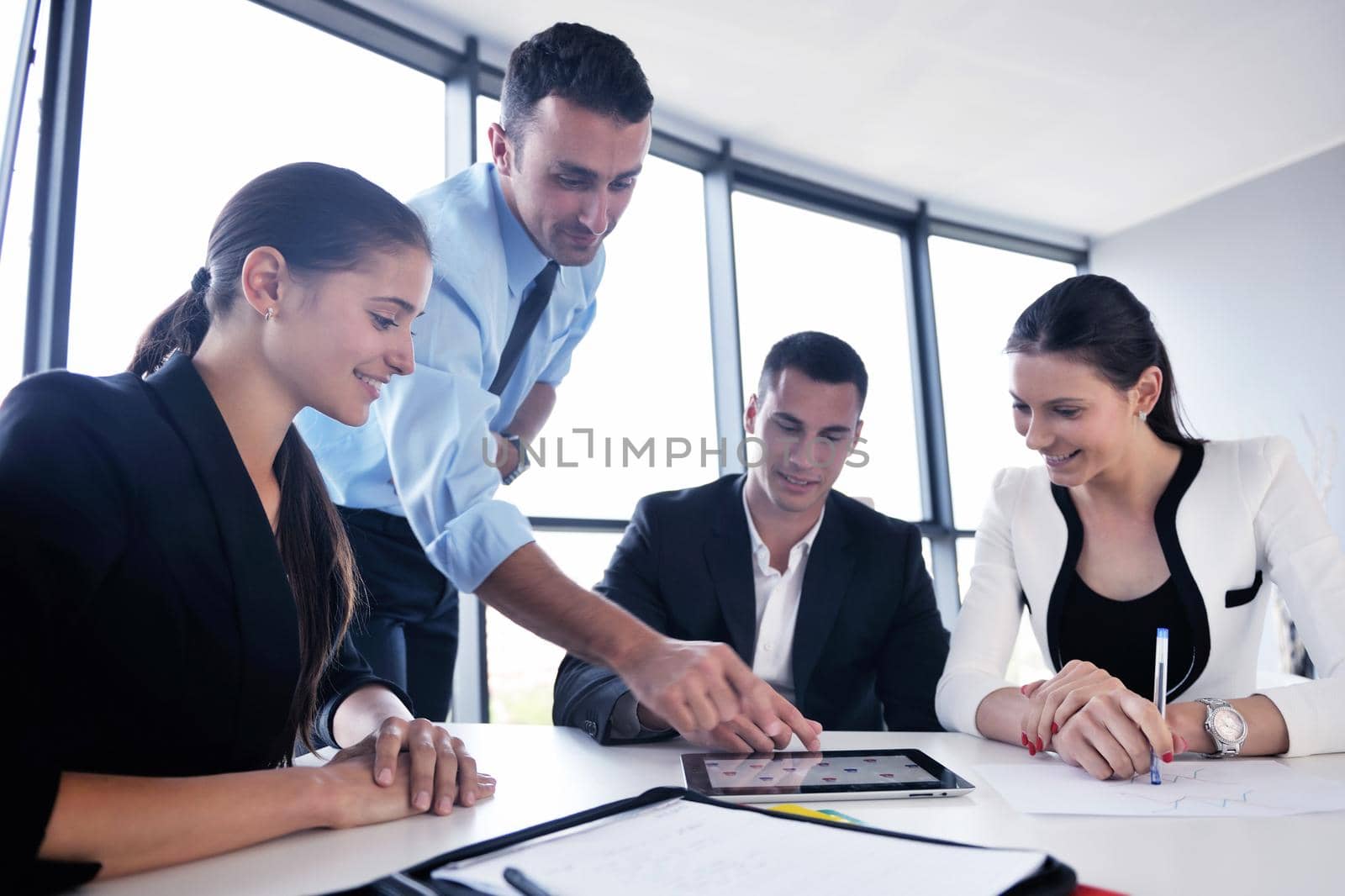 Group of happy young  business people in a meeting at office