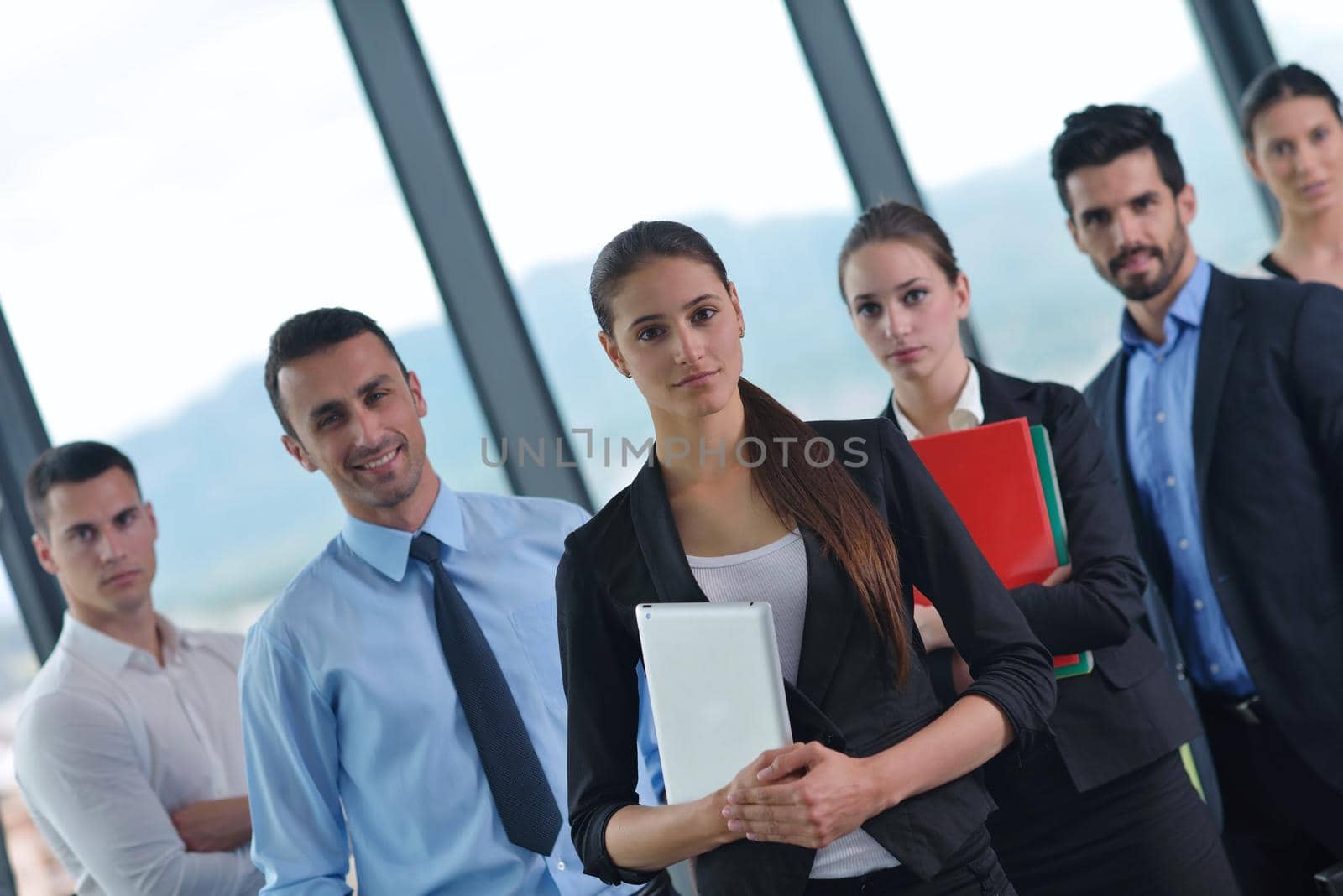 Group of happy young  business people in a meeting at office