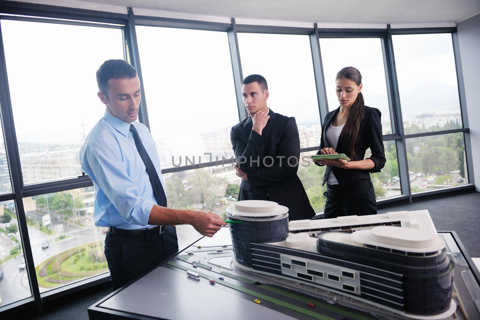 Group of happy young  business people in a meeting at office