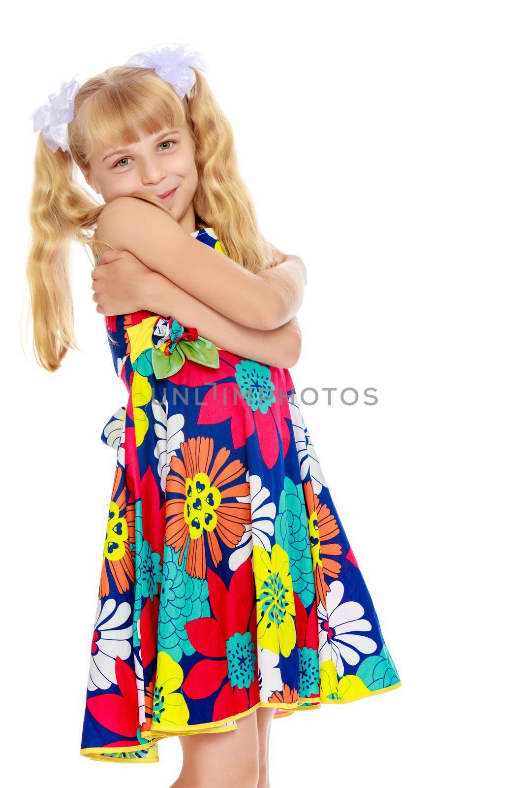 Sweet, adorable little girl with long blonde ponytails on her head tied with white bows. Close-up-Isolated on white background