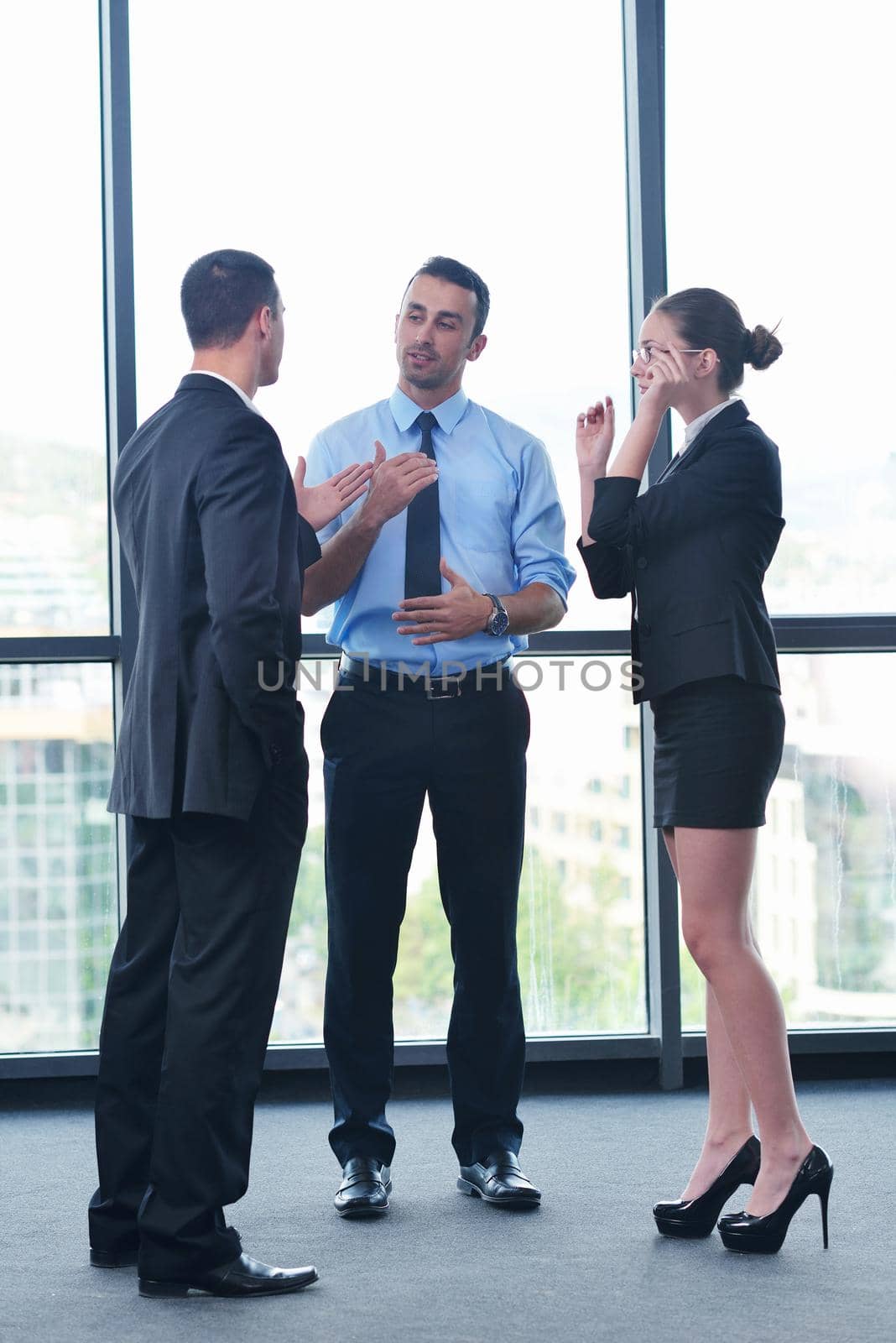 Group of happy young  business people in a meeting at office