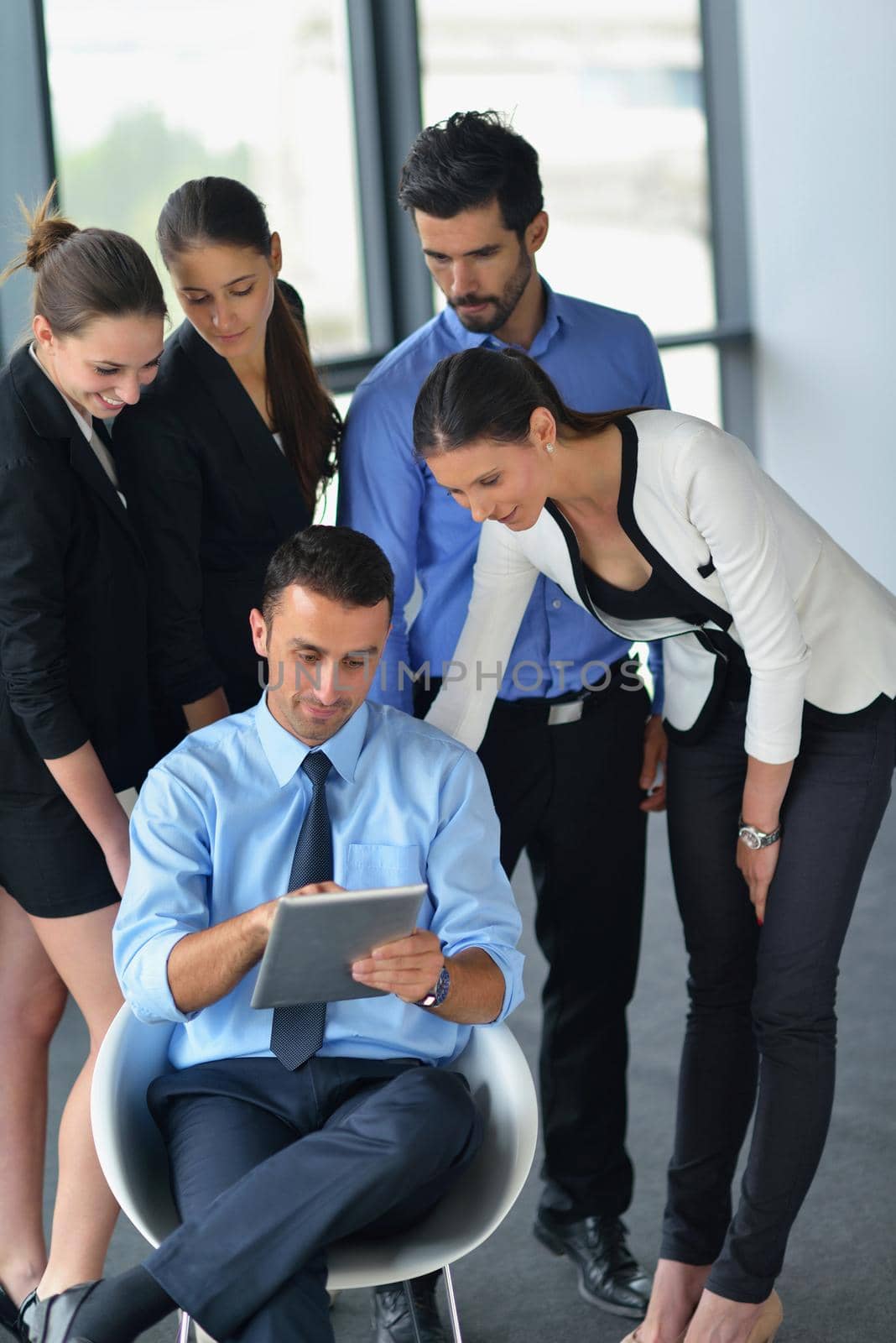 Group of happy young  business people in a meeting at office