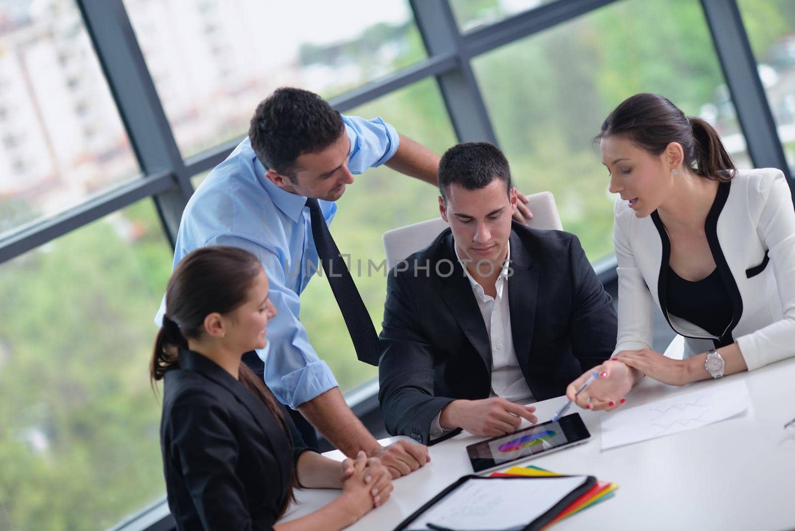 Group of happy young  business people in a meeting at office