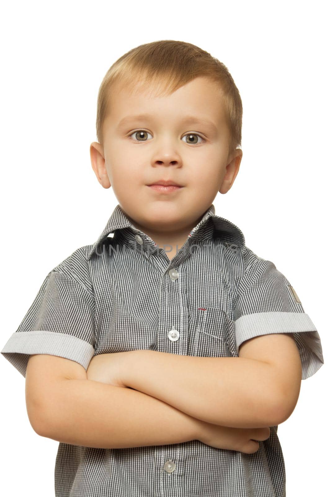 Cute little boy put his hands on his chest and looking directly at the camera. Close-up - Isolated on white background
