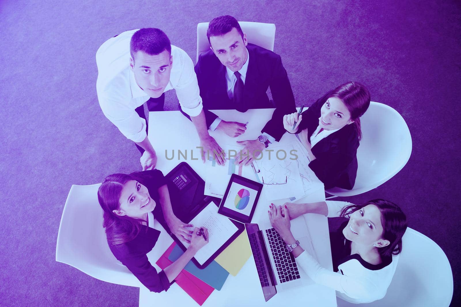 Group of happy young  business people in a meeting at office