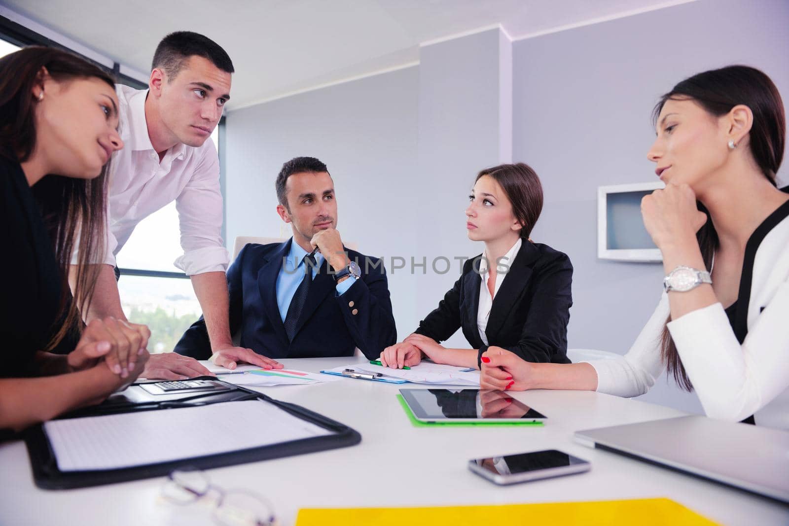 Group of happy young  business people in a meeting at office