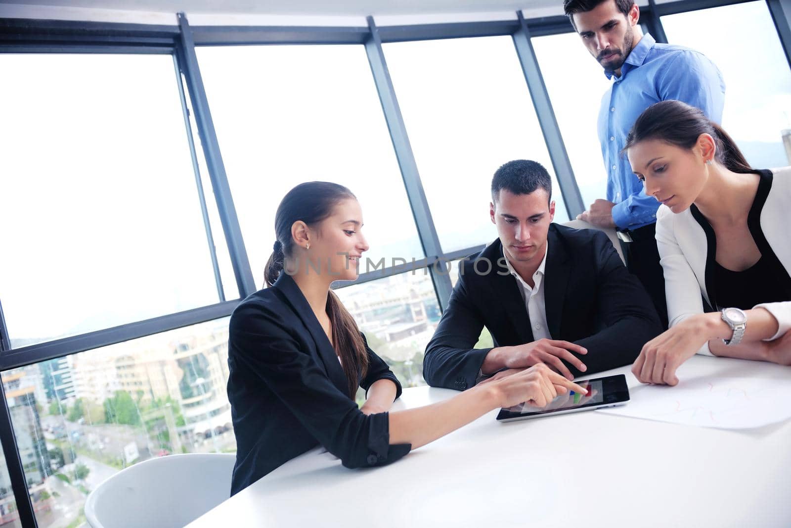 Group of happy young  business people in a meeting at office