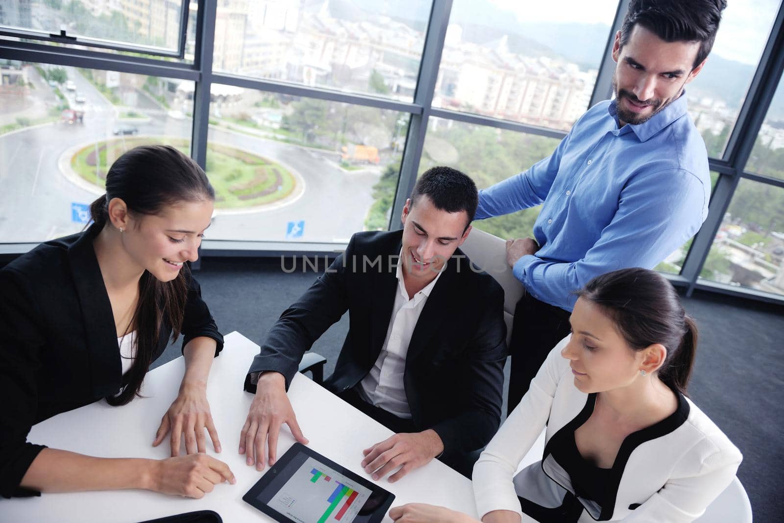 Group of happy young  business people in a meeting at office