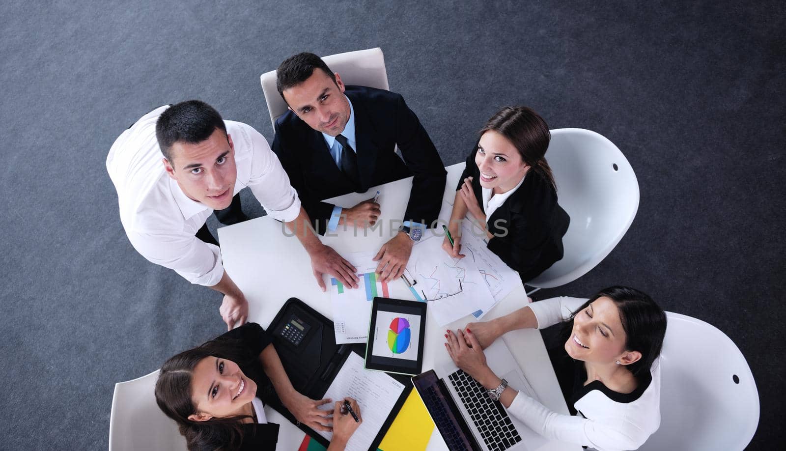 Group of happy young  business people in a meeting at office