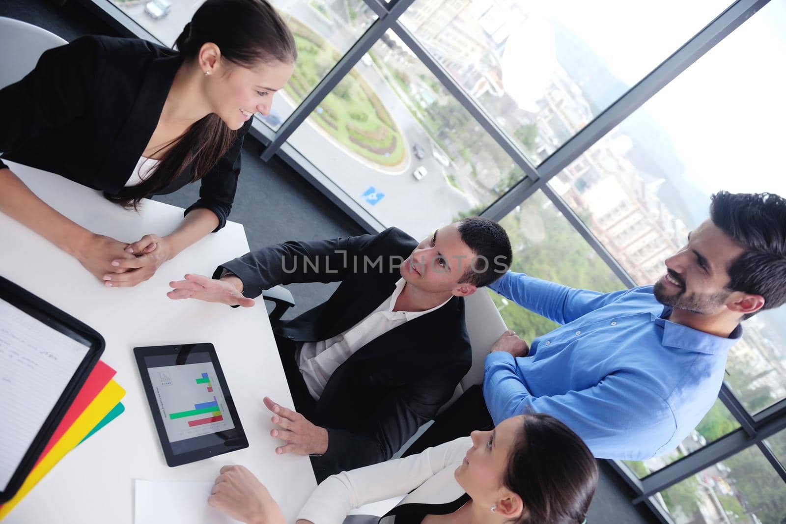 Group of happy young  business people in a meeting at office