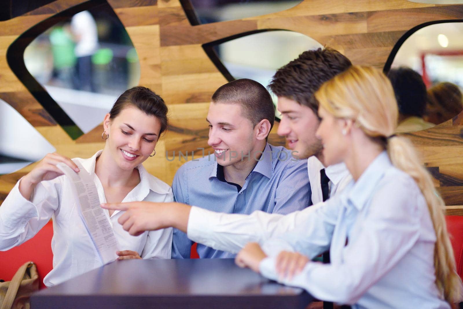 Group of happy young  business people in a meeting at office