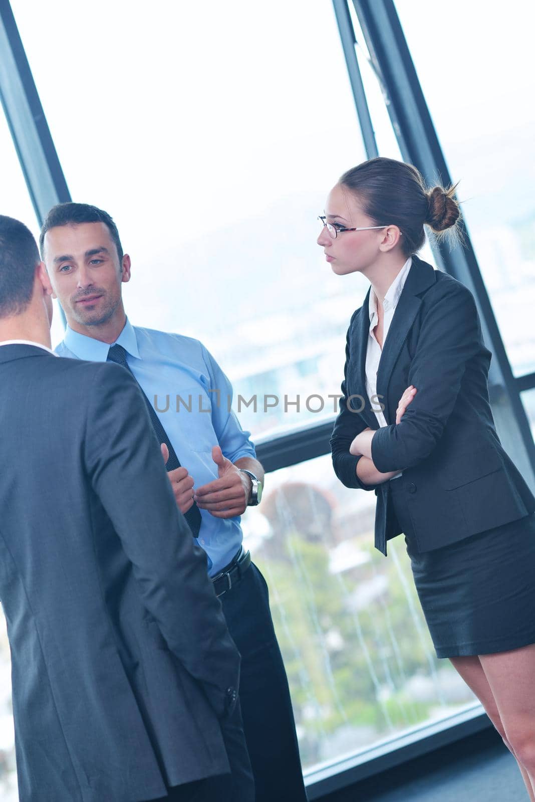 Group of happy young  business people in a meeting at office