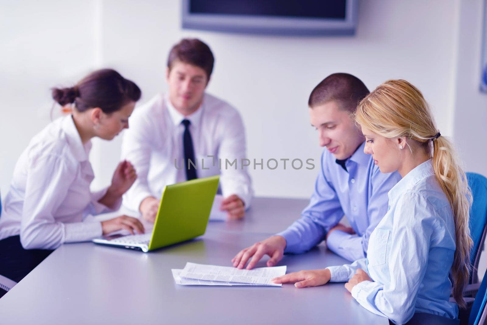 Group of happy young  business people in a meeting at office