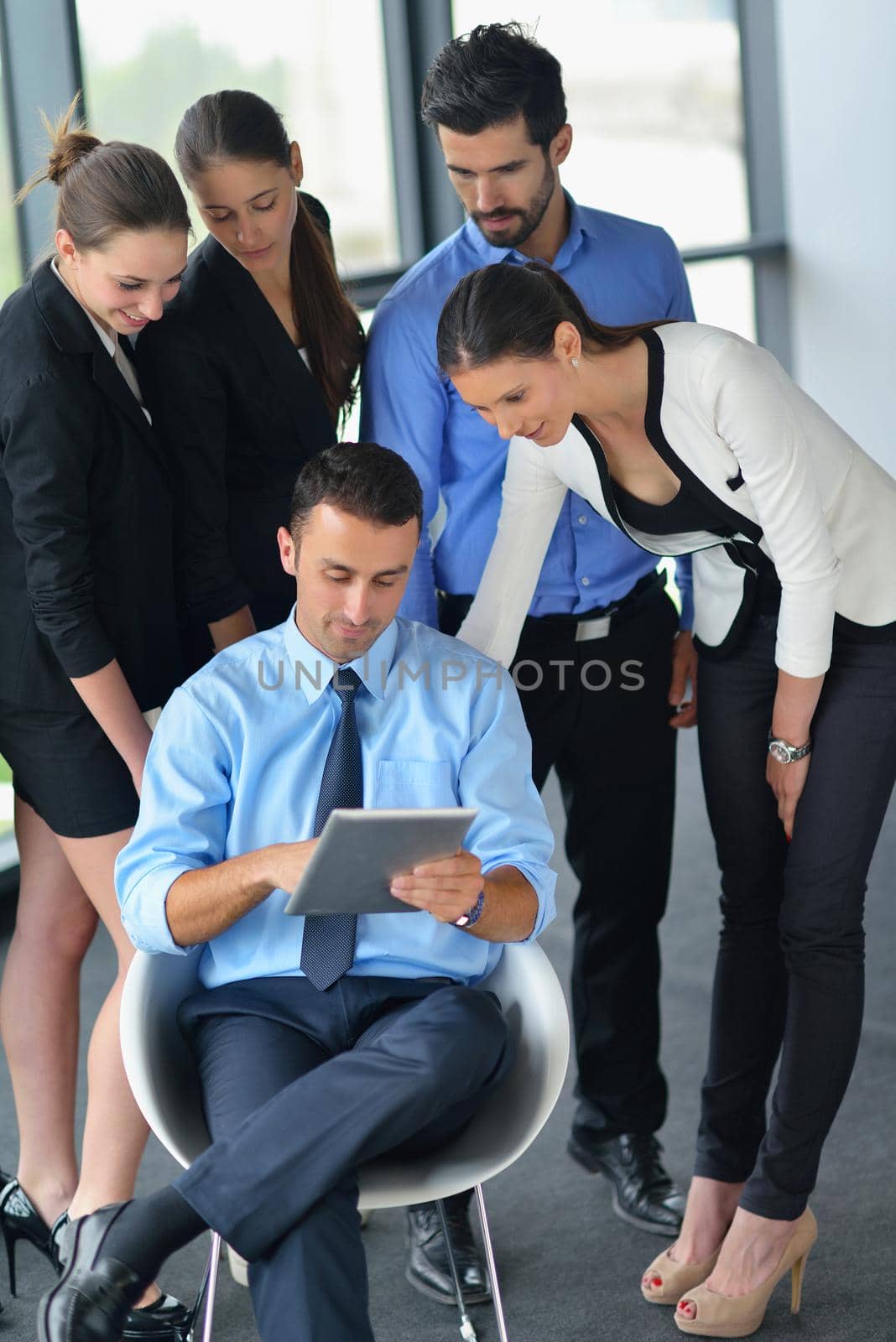 Group of happy young  business people in a meeting at office