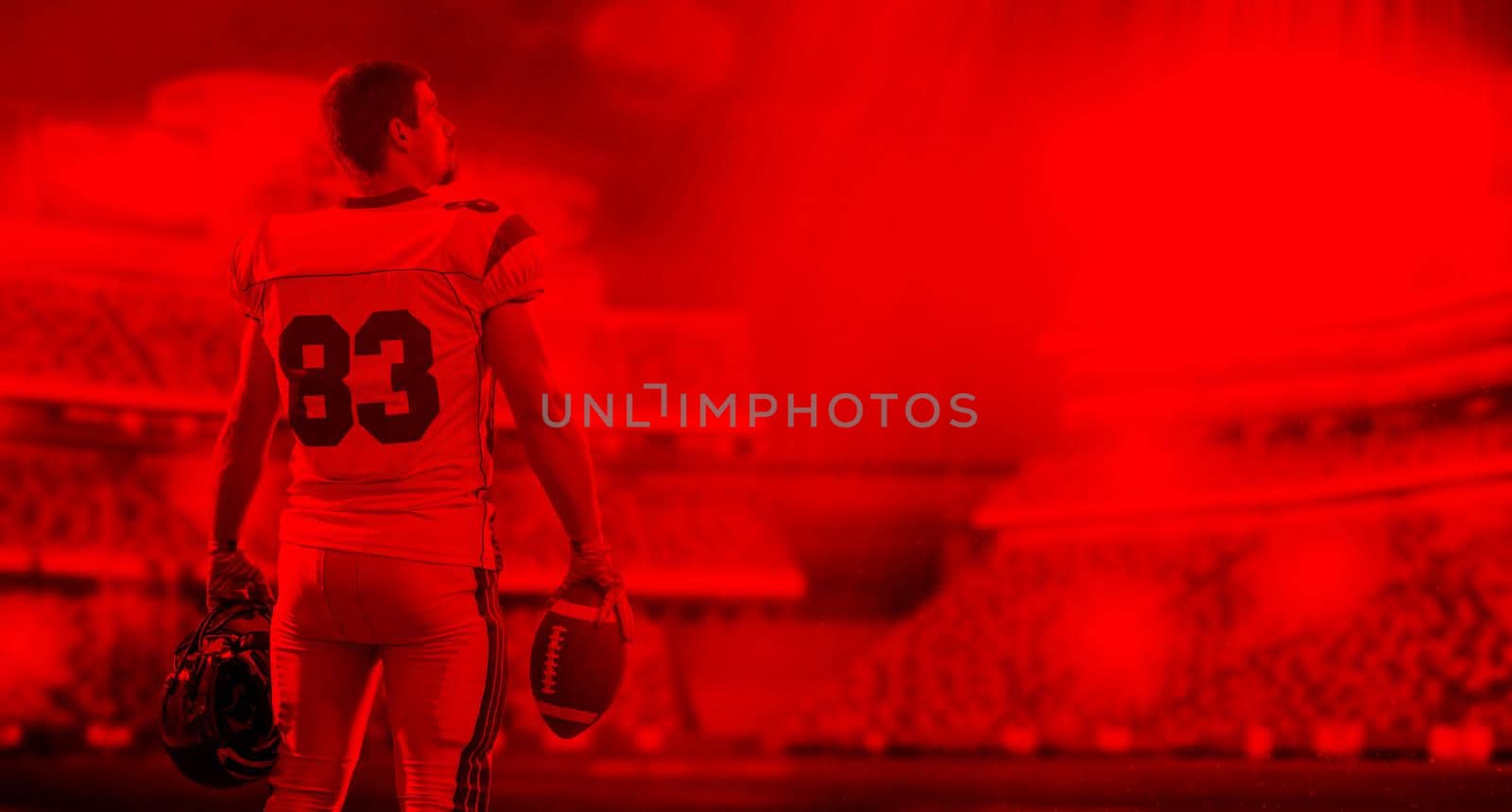 duo toned american football player in  arena at night with stadium lights
