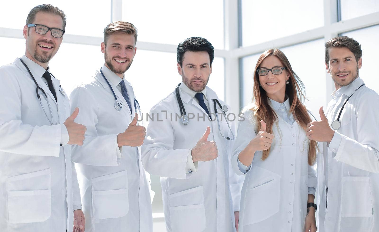 group of doctors showing thumbs up.the concept of health and service