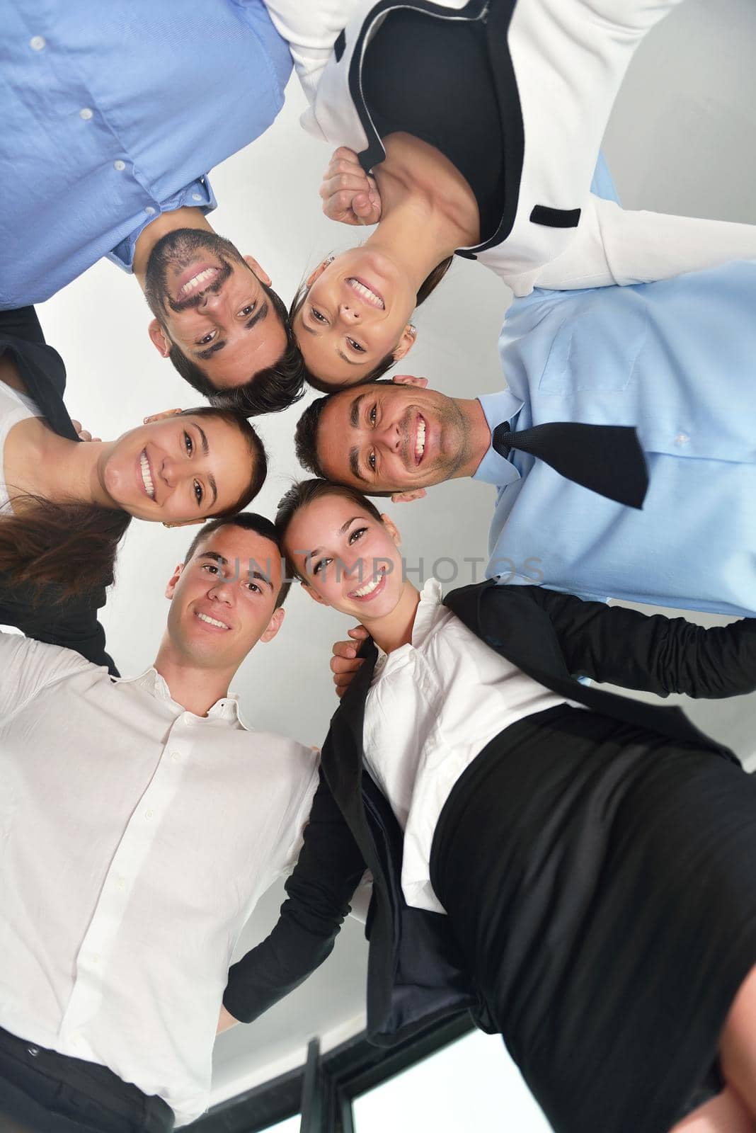 business people group joining hands and representing concept of friendship and teamwork,  low angle view