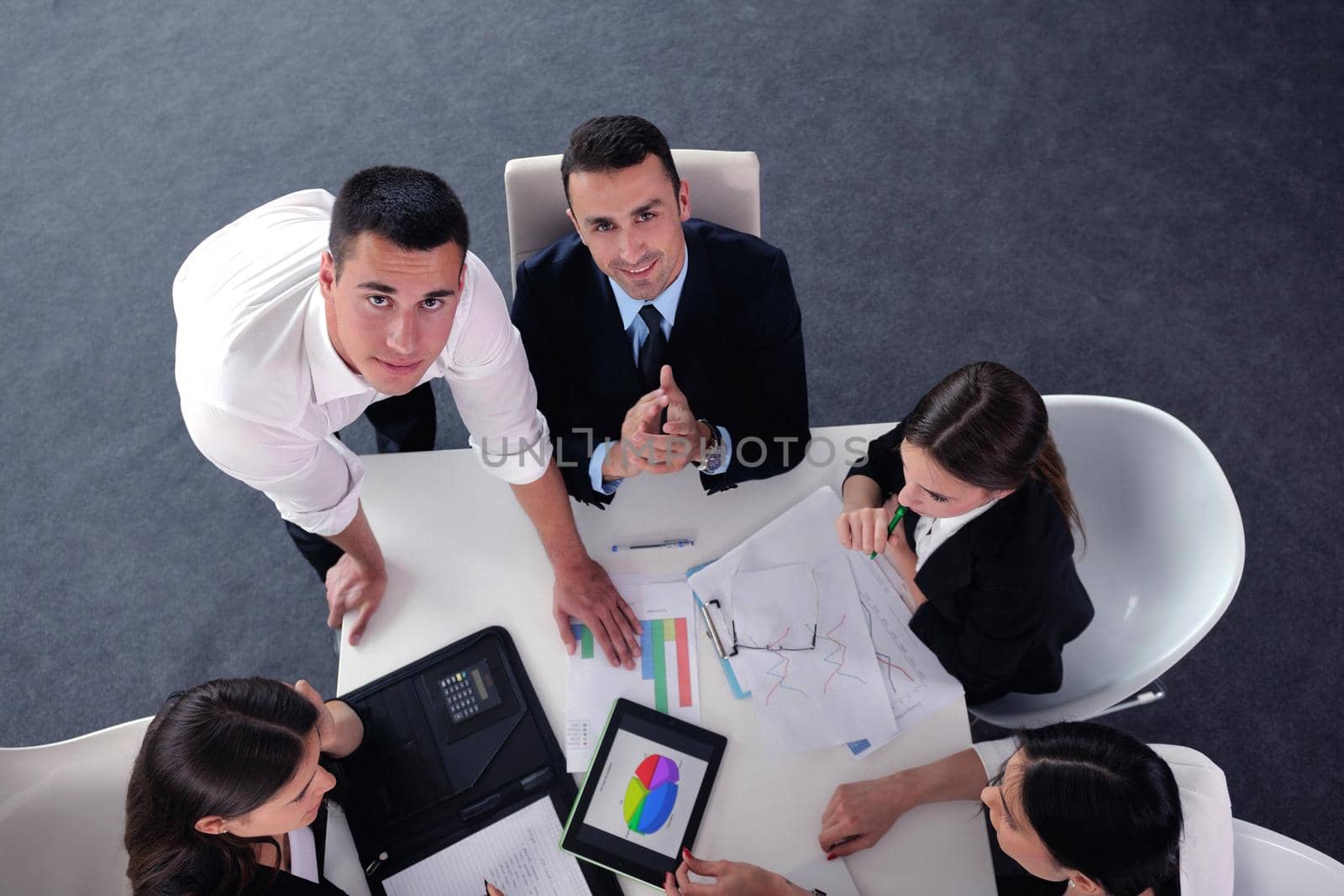 Group of happy young  business people in a meeting at office