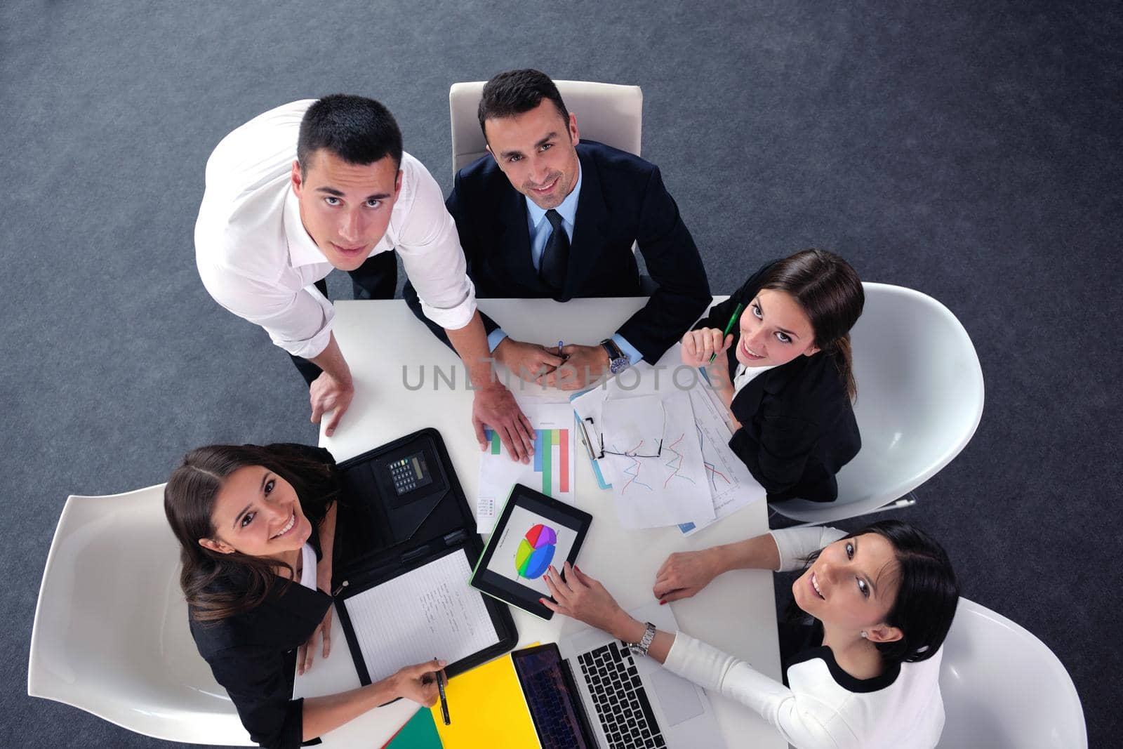 Group of happy young  business people in a meeting at office